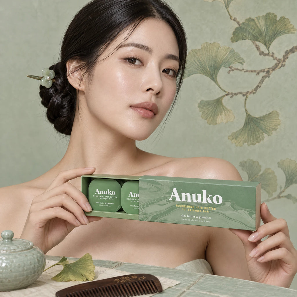Woman with a jade-pin knot holding the Anuko Travel Hair Butter case